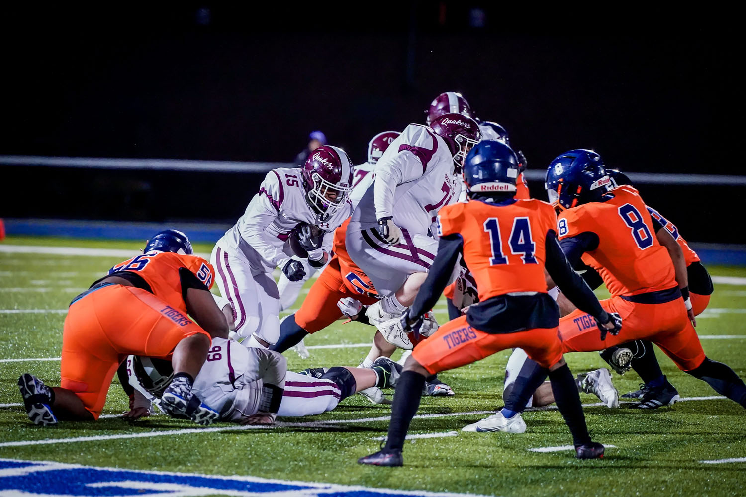RB running the ball through the line RB running the ball through the line
