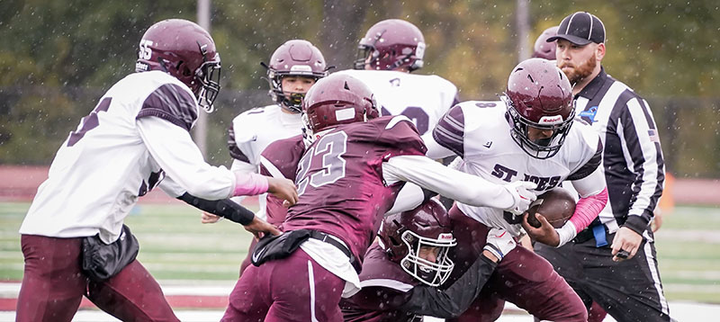 Freshman OP football making the tackle against St. Joe's