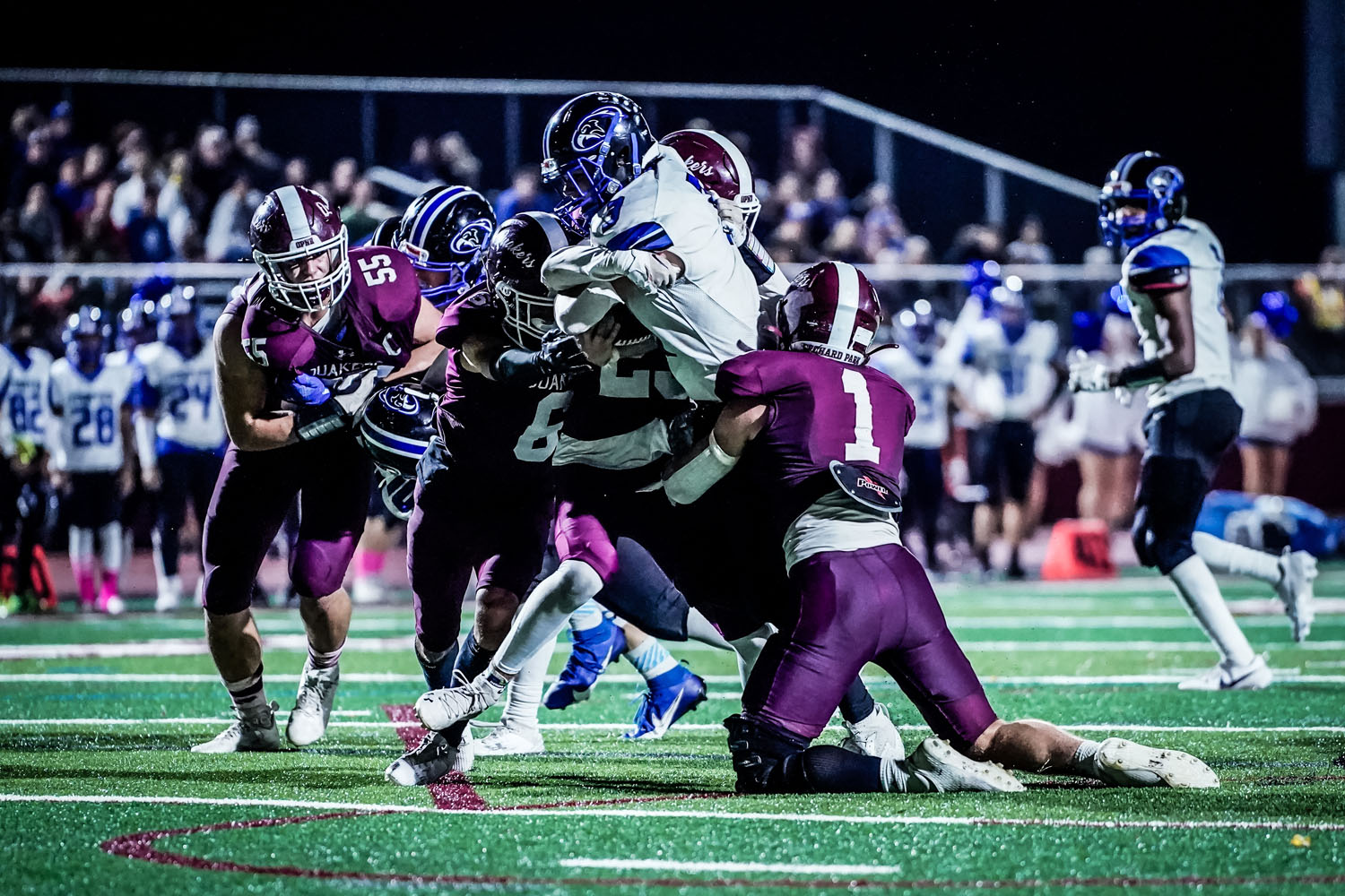 Defense making the tackle against Frontier Defense making the tackle against Frontier
