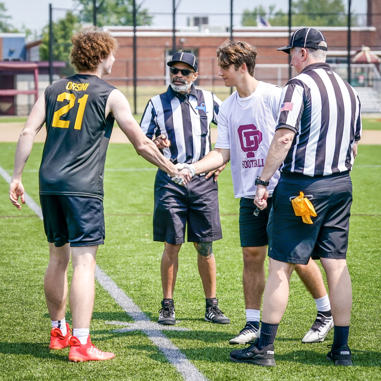 Players come out for the coin toss