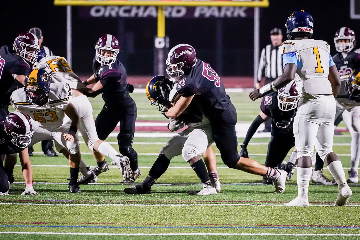 Defender bringing down the RB Defender bringing down the RB