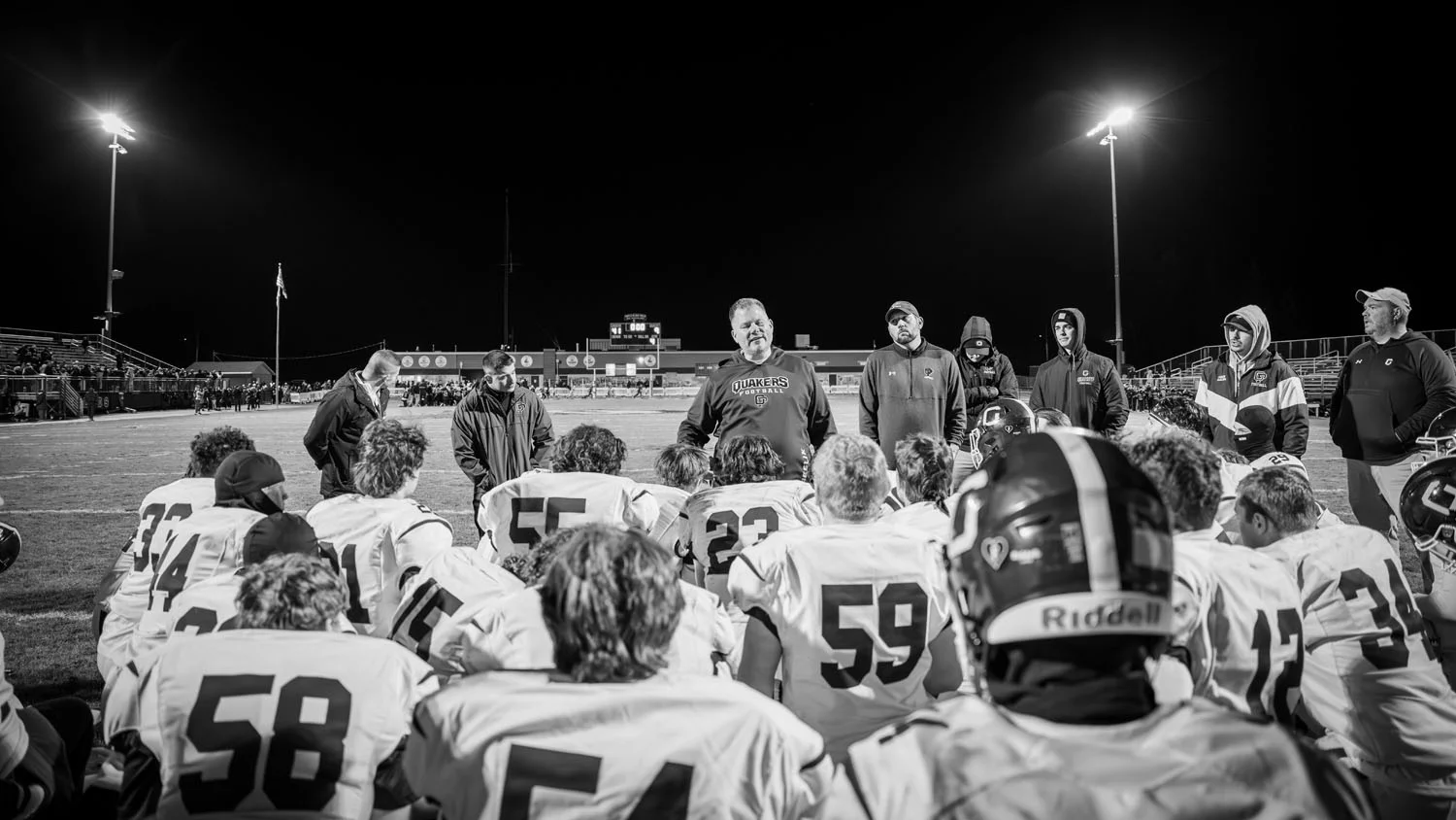 Coach talking to the team after the game Coach talking to the team after the game