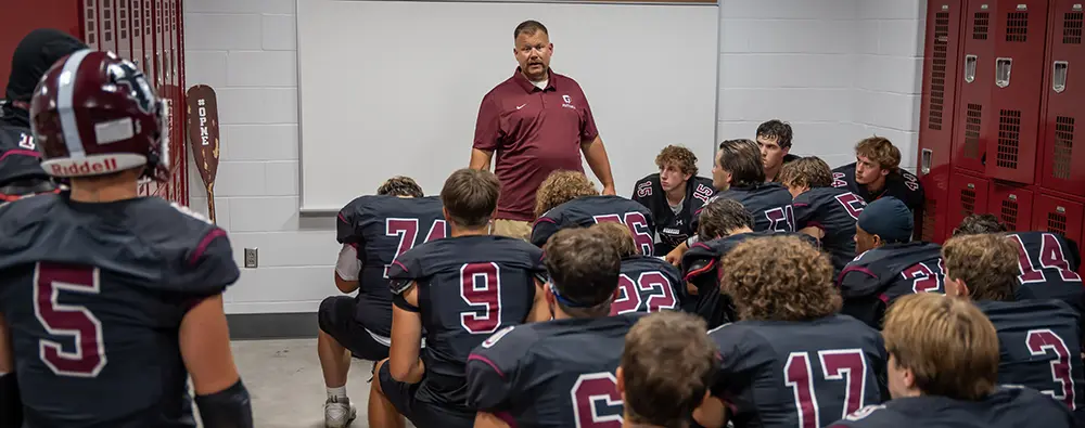 Coach speaking to the team before the game Coach speaking to the team before the game