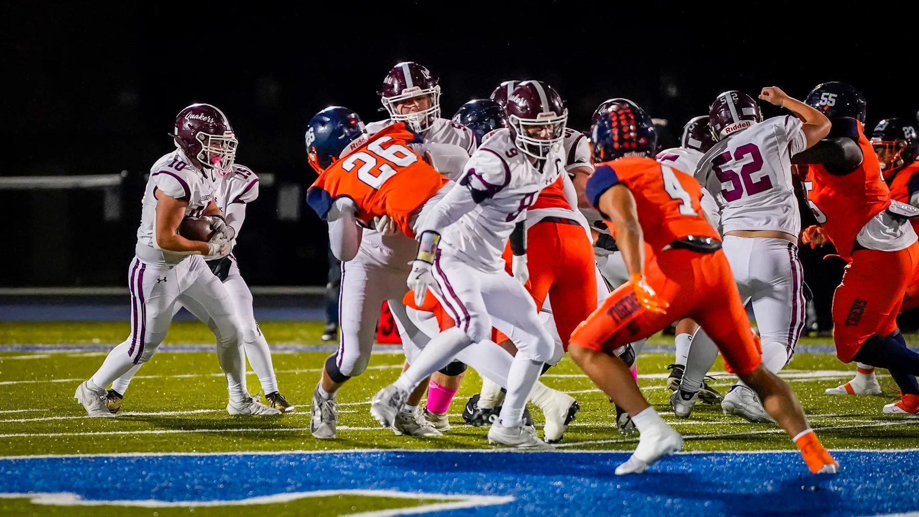 QB handing the ball off as the offense gets going