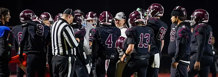 Orchard Park Quakers during a timeout