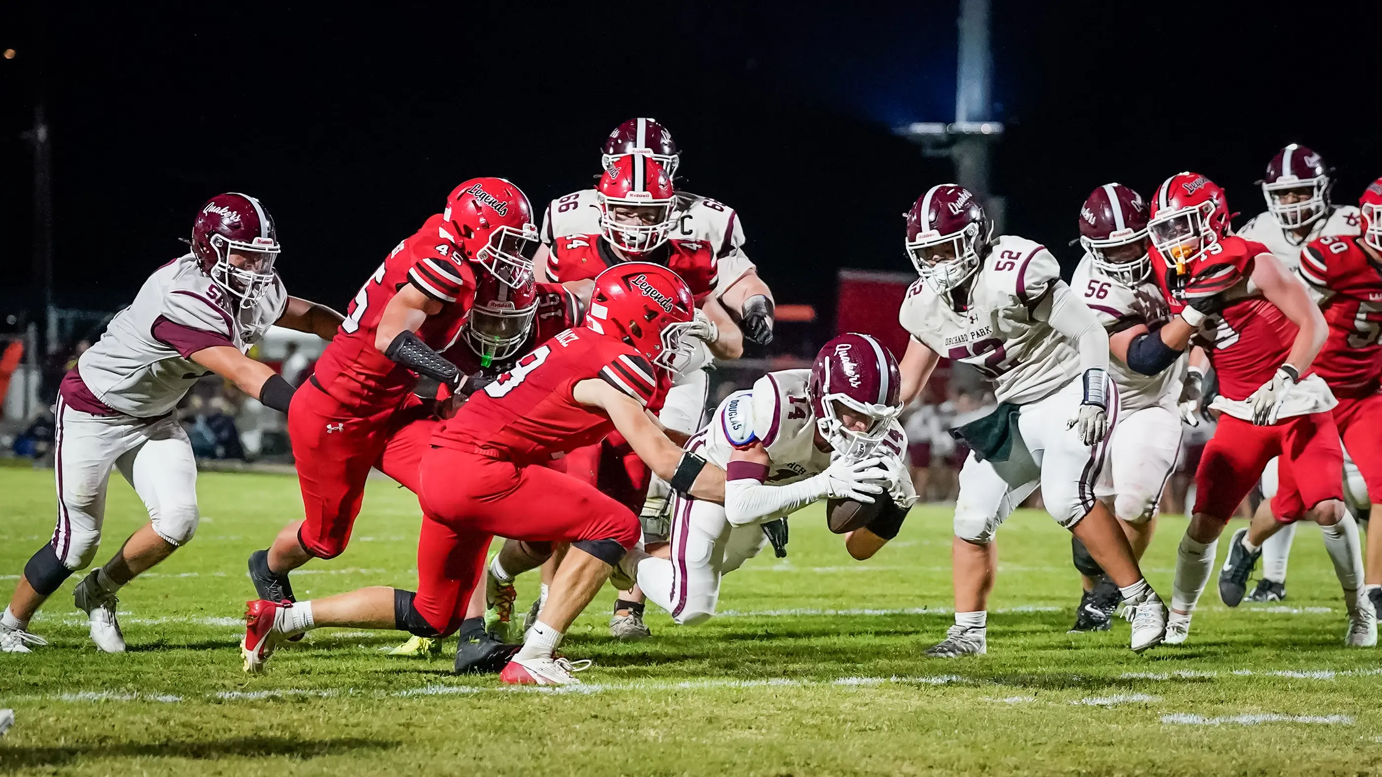 Orchard Park Football diving into the endzone