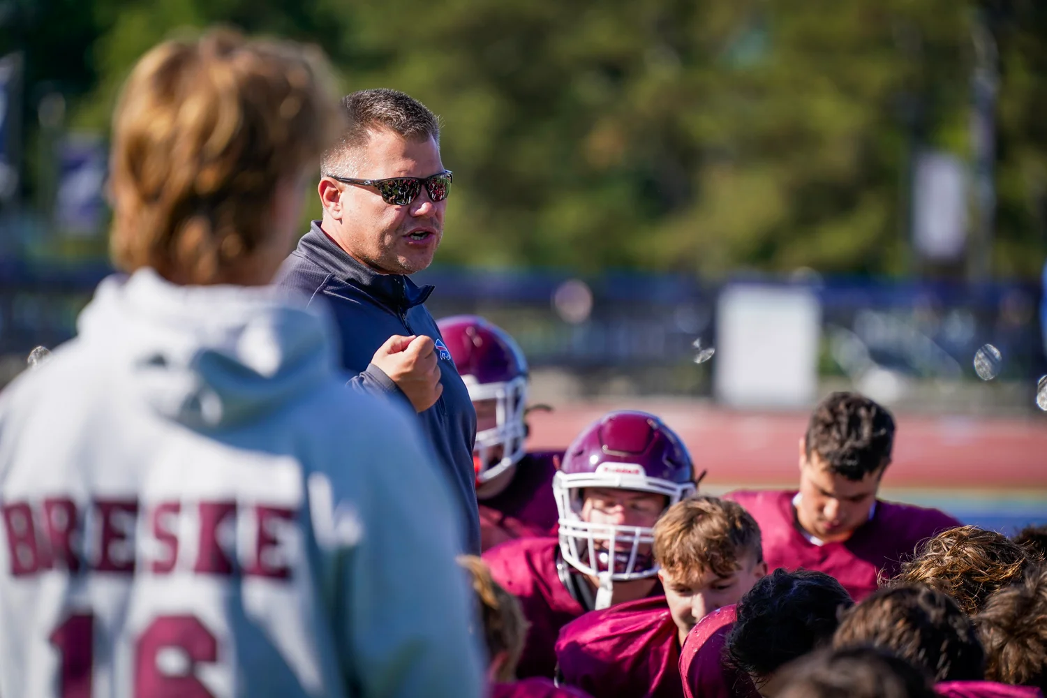 Coach talking to the team