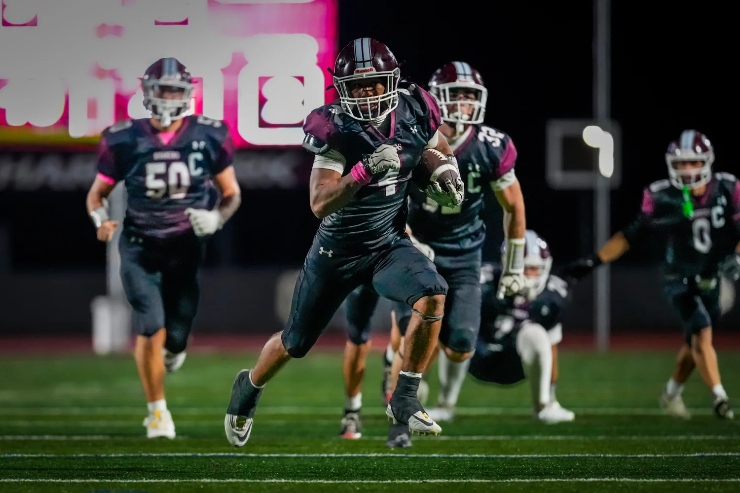 Orchard Park Football RB running down the field