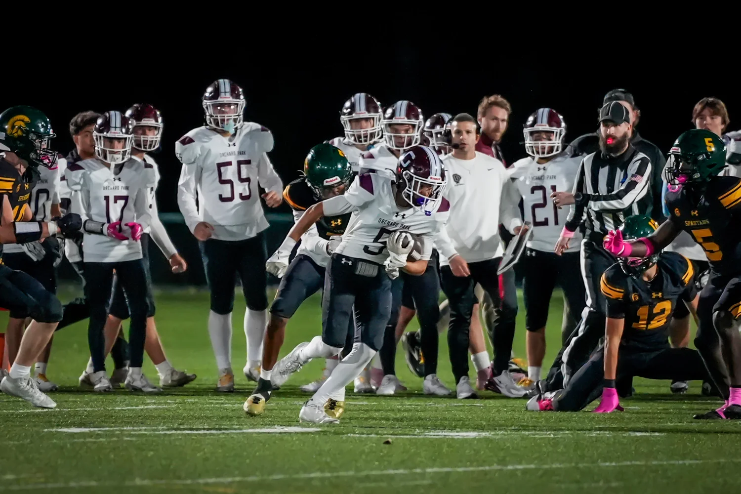 Orchard Park Football fighting for yards